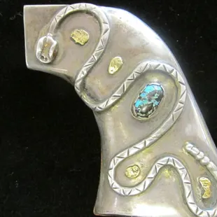 Turquoise decorated gun grips for the person who has everything!