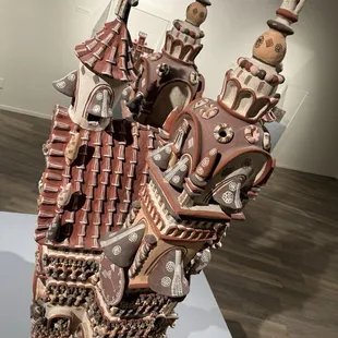 This beautiful little church sculpture is actually about 3 to 4 feet tall