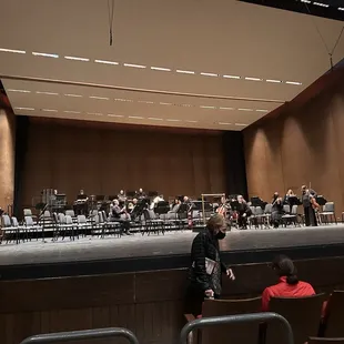 a man standing in front of a band