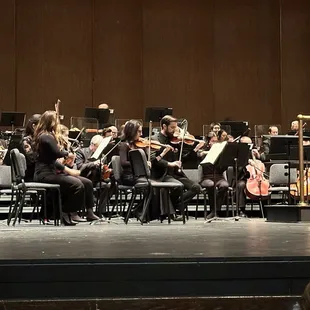 orchestra playing on stage