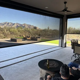 Customers enjoying the view through the screens on their patio