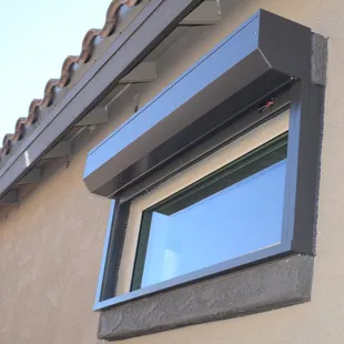 Rolling shutter on fixed bathroom window