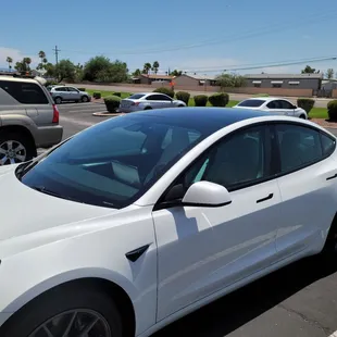 This is a Tesla they just finished total around all windows and windshield