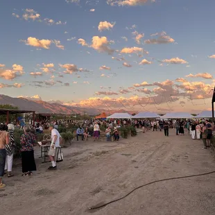 a large crowd of people at an outdoor market
