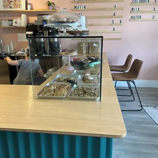 a counter with a variety of pastries