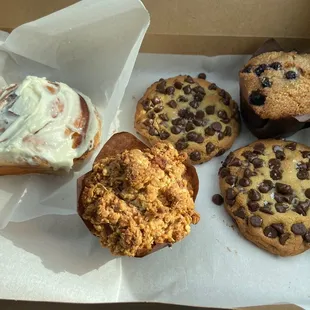 Cinnamon roll, banana coffee cake, blueberry muffin, chocolate chip cookies