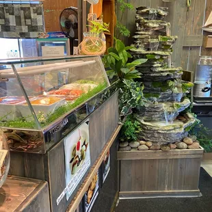 Cool looking waterfall up against the sushi bar