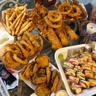 Fish and chips, Zucchini, onion rings, 2 sushi rolls.
