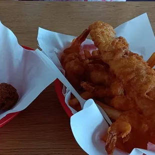 Fish and prawn combo with a side of hush puppies