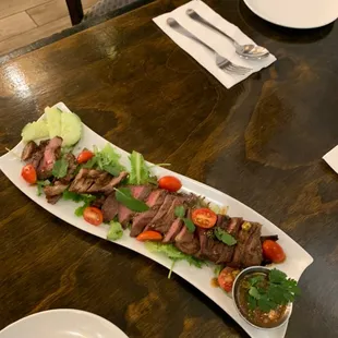 Sa-Rong-Thai, Premium angus beef grilled and sliced with Thai sauce topping on it.