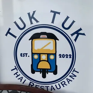 a sign for tuk tuk thai restaurant