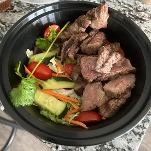 a bowl of meat and vegetables
