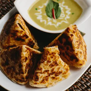 Roti bread with green curry dipping sauce