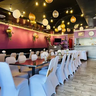 a dining area with tables and chairs