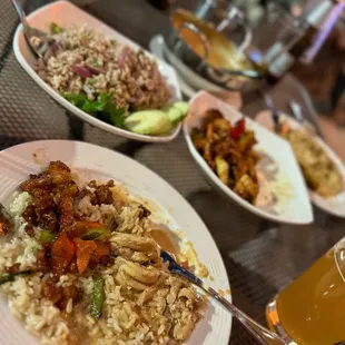a plate of rice with meat and vegetables
