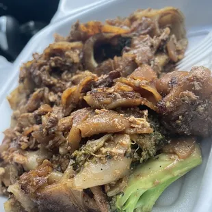 a close up of a meal in a styrofoam container