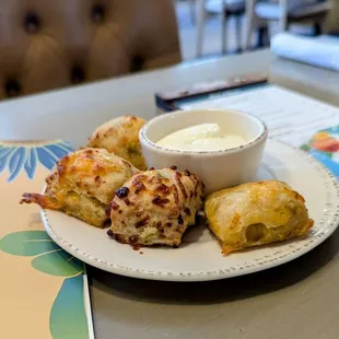 Lagniappe of green chile chedder biscuits and honey butter.