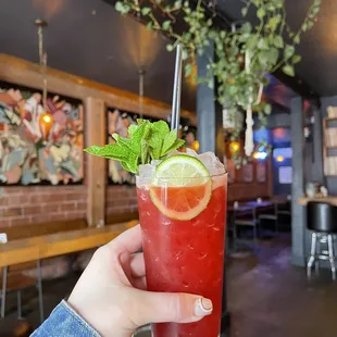 a person holding a drink