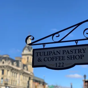 a sign for tulipan pastry and coffee shop