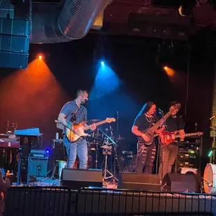 a band performing on stage
