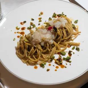 a plate of pasta with shrimp