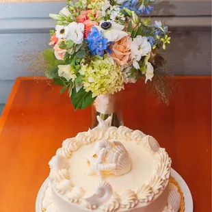 a wedding cake and flowers
