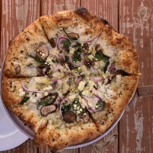 Go Green specialty pizza (small): pesto, red onion, mushrooms, artichokes, spinach, basil, mozzarella, and goat cheese