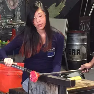 Makenzie working on her glass flower