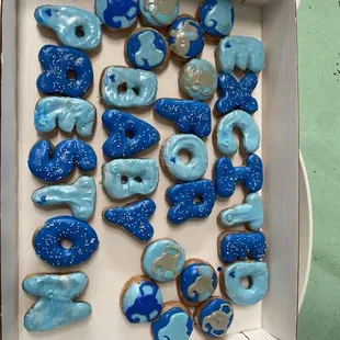 a box of blue frosted donuts