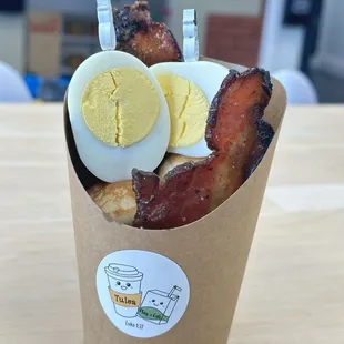 "Brunchy cup" includes pancake bites, hard-boiled egg, candied bacon, and organic maple syrup