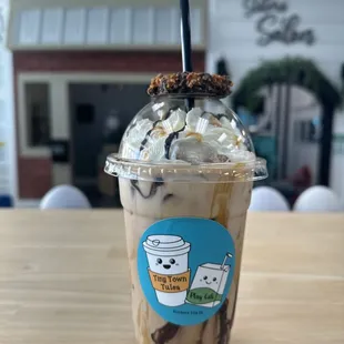 Secret menu: Samoa Mocha; dark chocolate, caramel, coconut iced latte with a fun Samoa girl scout cookie on top!