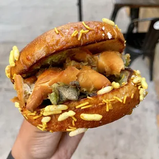 Dabeli. Spicy Potato Patty Sliders, Topped with Triple Chutney Mix.