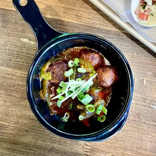 Veg Manchurian With Gravy.
Wisps of vegetables formed into dumplings and dunked into a sauce.