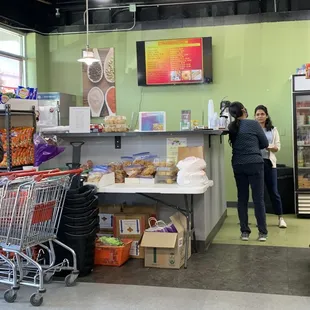 a woman standing at the counter