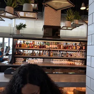 Don&apos;t mind my daughter&apos;s head, but it&apos;s a fully stocked bar here!