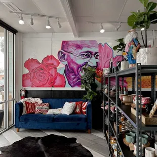 Cozy couch. Colorful wall art.