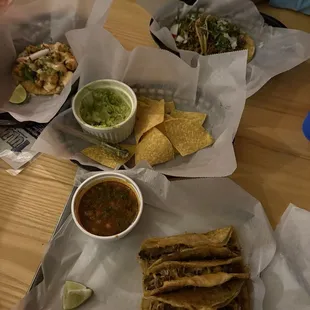 Birria tacos, shrimp, steak tacos plus chips and guacamole.