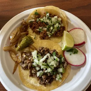 Chorizo taco (top taco) and asada (bottom taco)