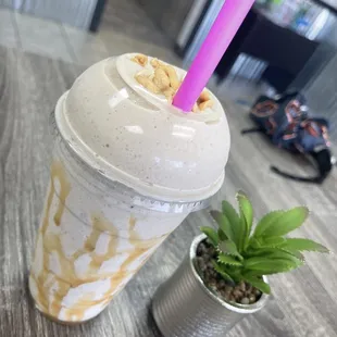 a smoothie in a cup with a straw