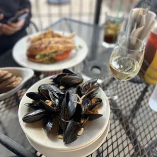 Beer Mussels and glass of Savignon Blanc