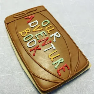 Our Adventure Book custom cookie.