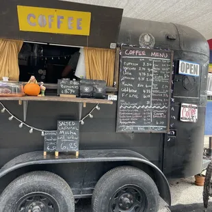 a coffee truck with chalkboard menus