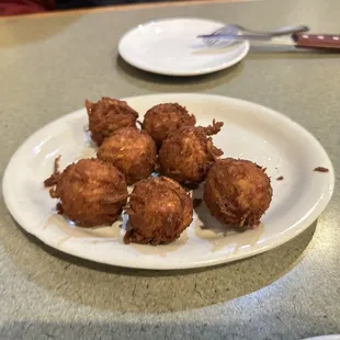 a plate of fried food on a table