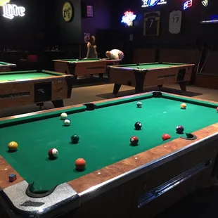 6 pool tables and 4 dart boards