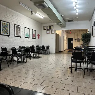 a large room with tables and chairs