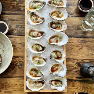 a platter of oysters on ice