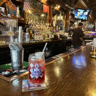 a bar with a drink on the bar