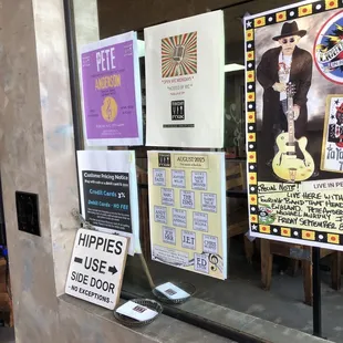 posters on the wall of a restaurant