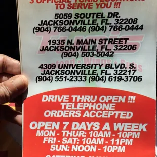 a hand holding a sign