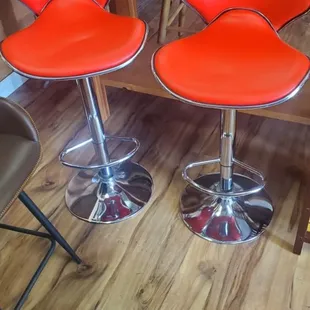 a pair of red bar stools
